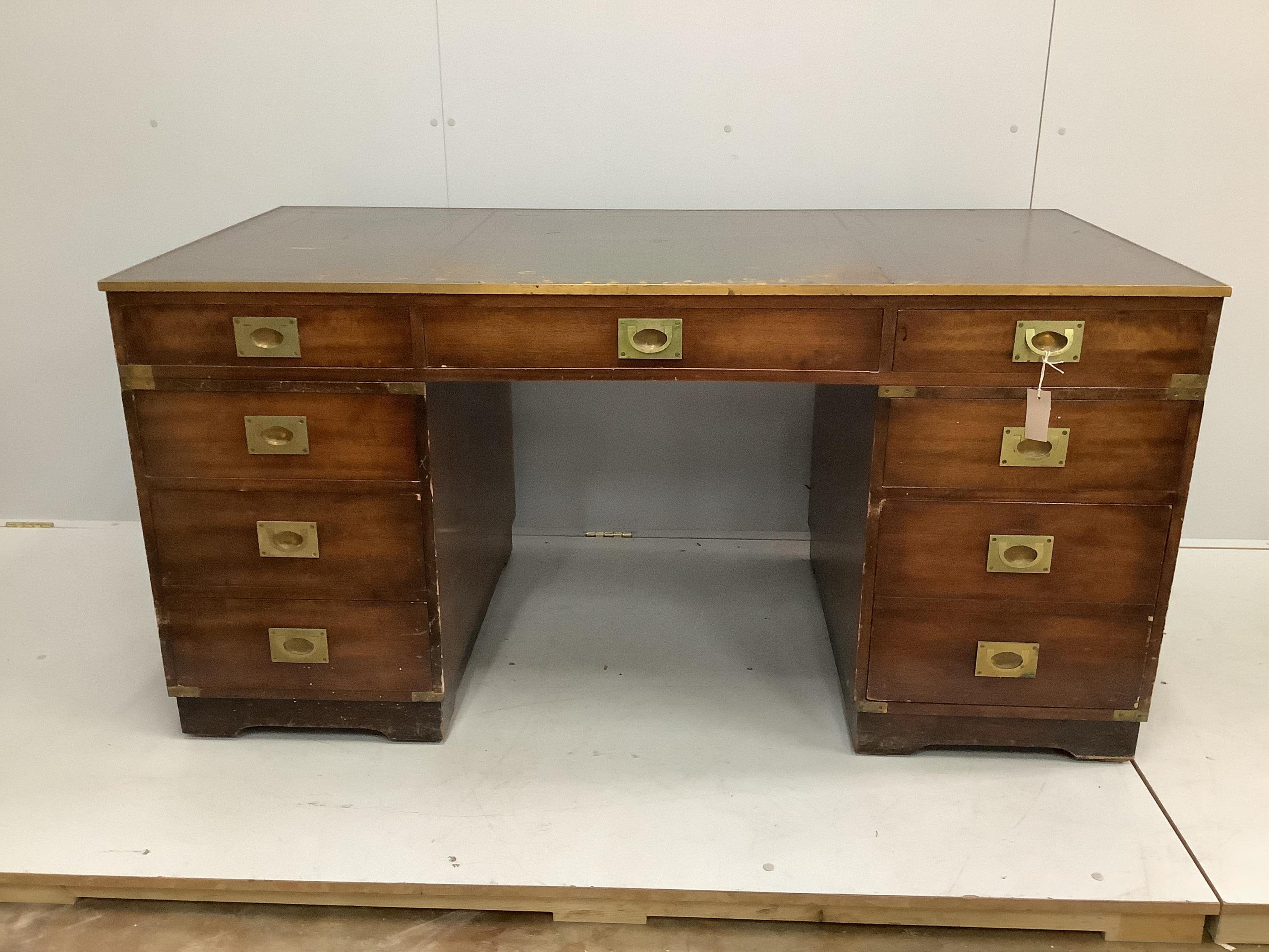 A mid century brass mounted military style mahogany twin pedestal desk, width 153cm, depth 77cm, height 75cm. Condition - fair